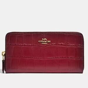 Lovely used embossed leather Coach wallet.